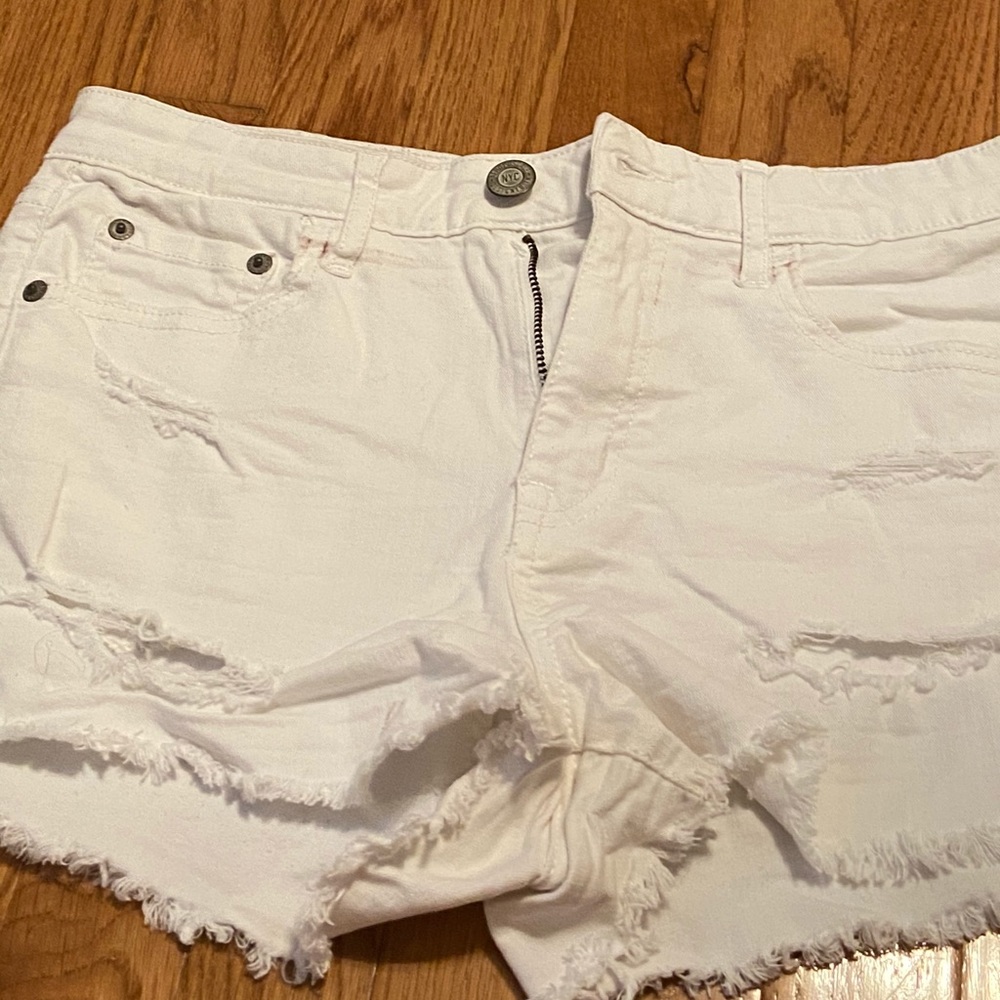 white ripped shorts